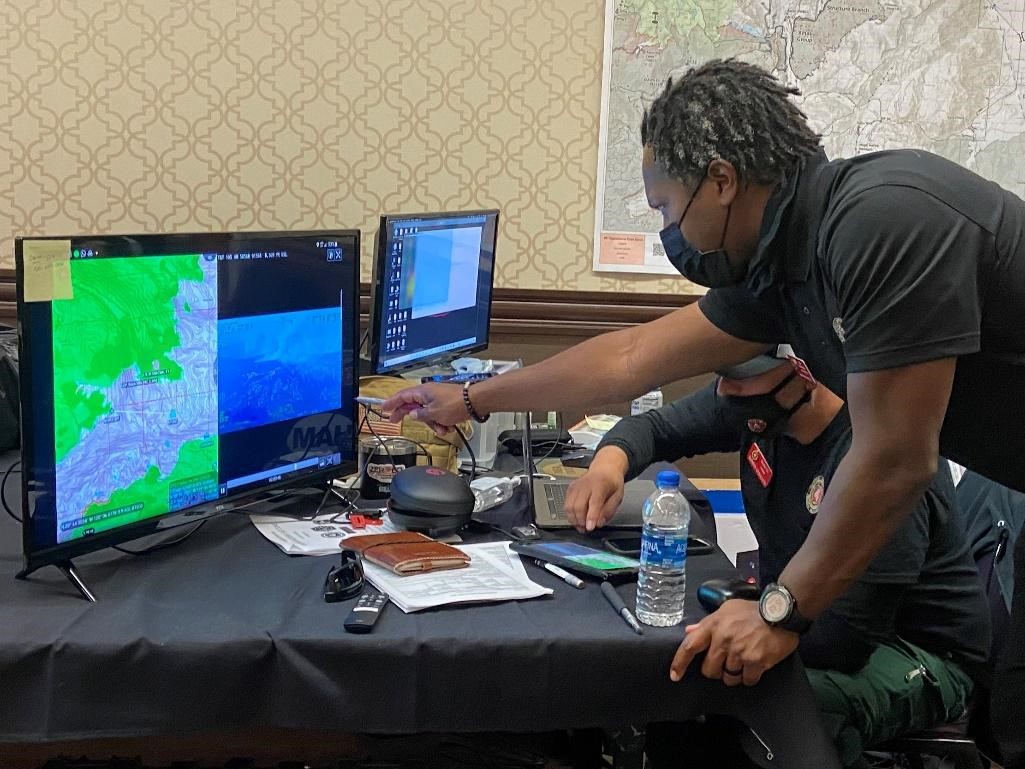 Photo 3 Fire managers viewing intelligence in the Team Awareness Kit app on the Caldor Fire Sept 9 2021